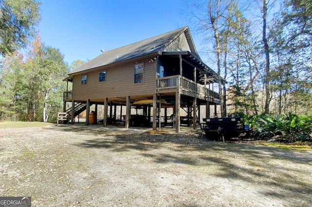 rear view of house with a carport