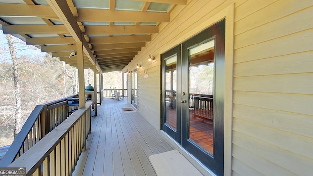 wooden deck featuring french doors