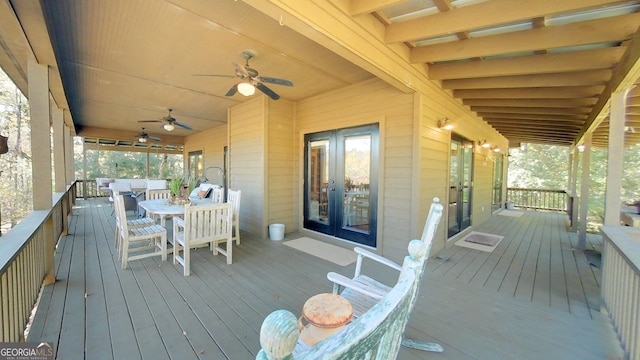 wooden terrace featuring french doors and ceiling fan