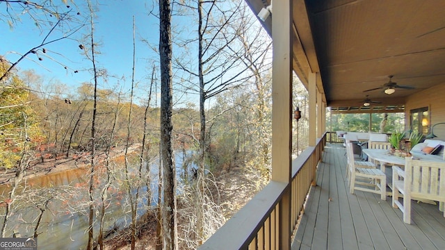 wooden terrace featuring ceiling fan