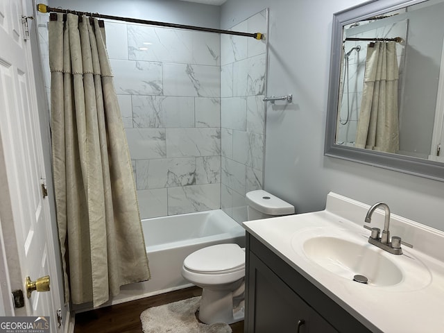 full bathroom featuring vanity, toilet, wood-type flooring, and shower / bathtub combination with curtain