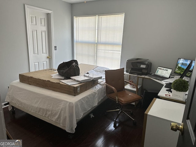 bedroom with dark wood-type flooring