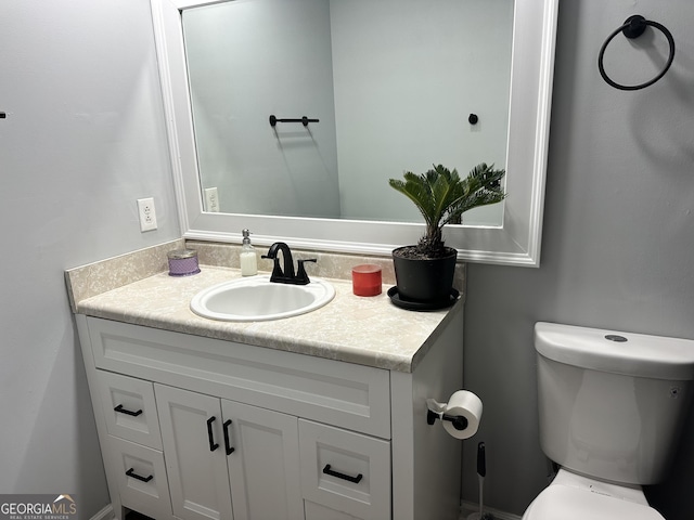 bathroom with vanity and toilet