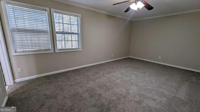 spare room with carpet, ceiling fan, and crown molding