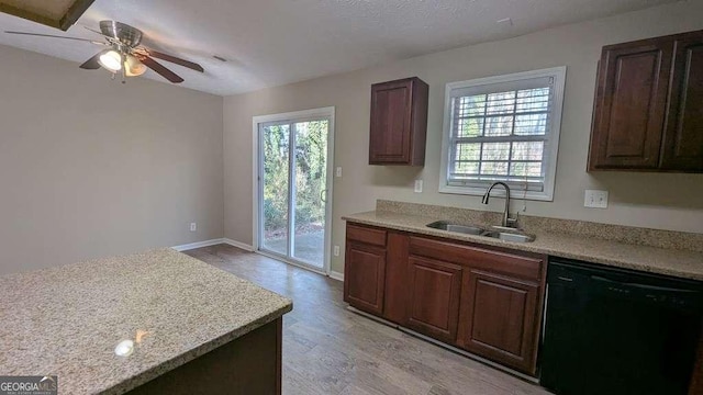 kitchen with light wood-type flooring, dark brown cabinets, ceiling fan, sink, and dishwasher