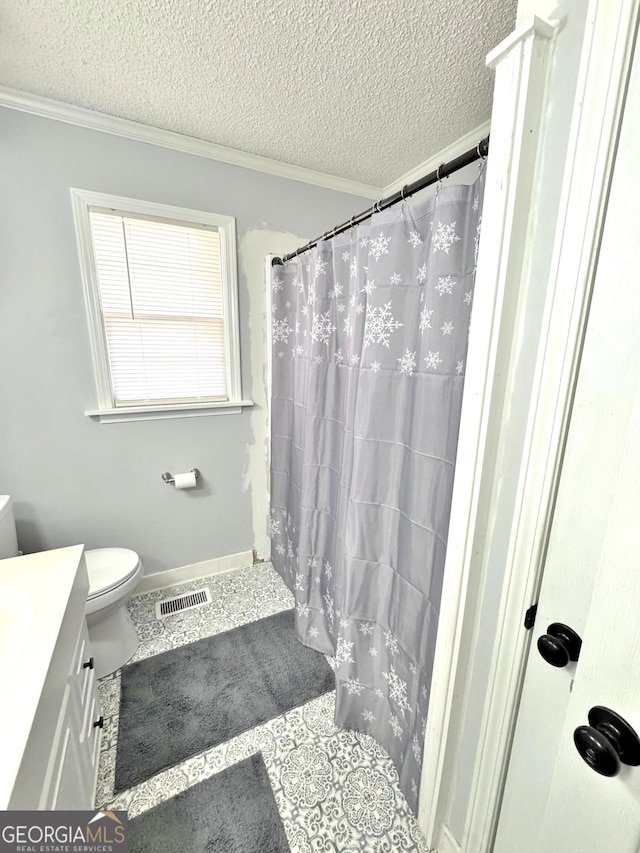 bathroom with walk in shower, a textured ceiling, vanity, crown molding, and toilet