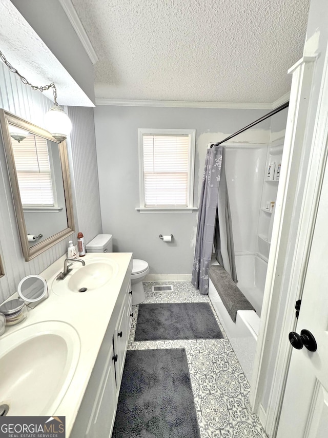 full bathroom featuring crown molding, vanity, a healthy amount of sunlight, and a textured ceiling