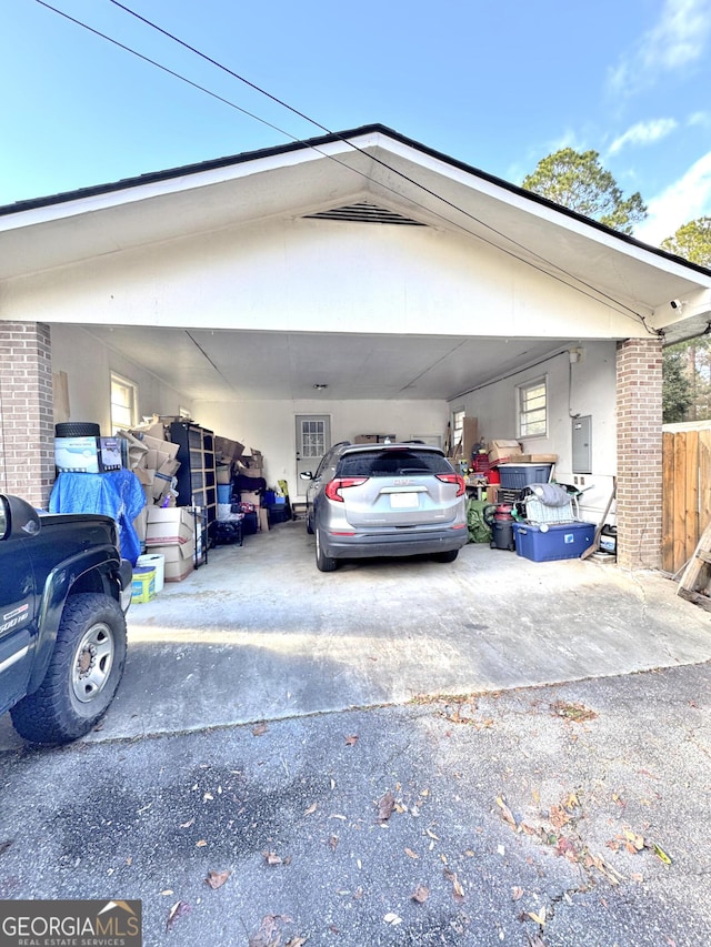 view of car parking with electric panel