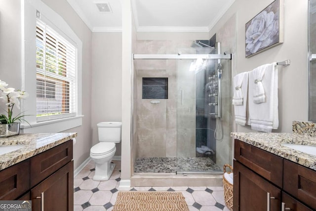 bathroom with crown molding, a shower with door, a healthy amount of sunlight, and toilet