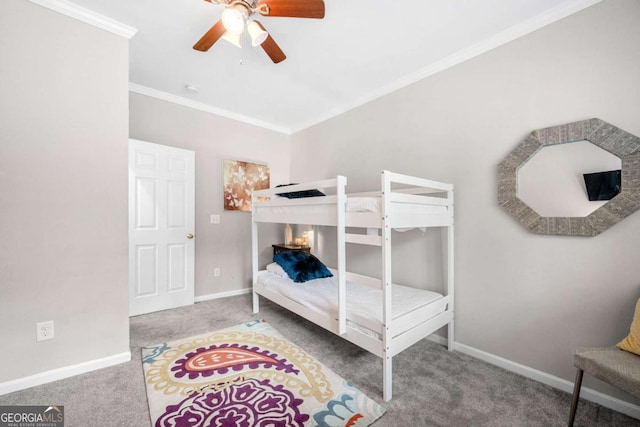 bedroom with carpet flooring, ceiling fan, and crown molding