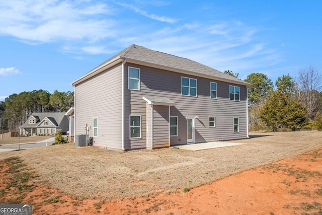 rear view of property with a patio area and central AC unit