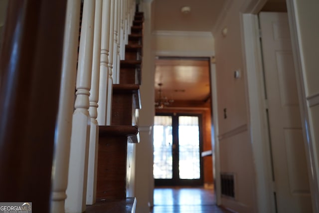 hallway featuring crown molding and french doors