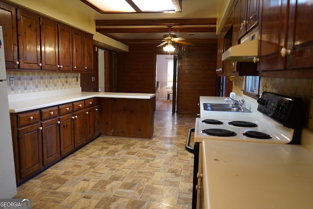 kitchen featuring sink, electric range oven, kitchen peninsula, ceiling fan, and beam ceiling