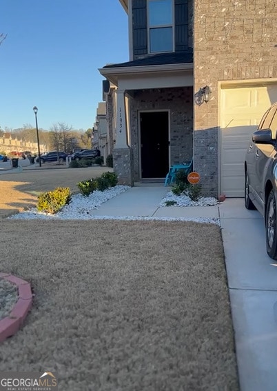 doorway to property featuring a garage