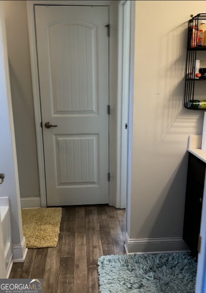 bathroom with hardwood / wood-style flooring and vanity