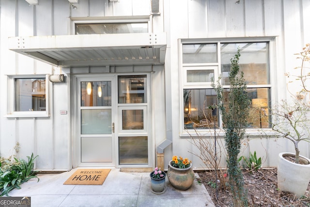 entrance to property featuring board and batten siding