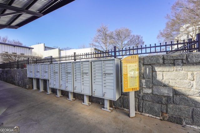 surrounding community with mail area and fence