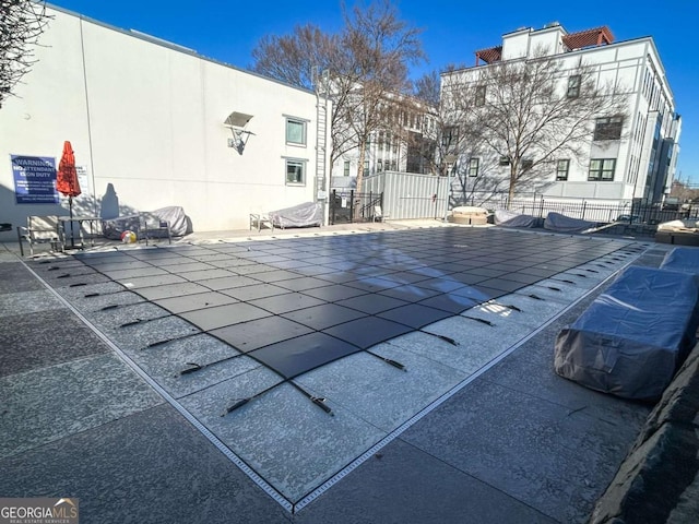 view of swimming pool with a patio area