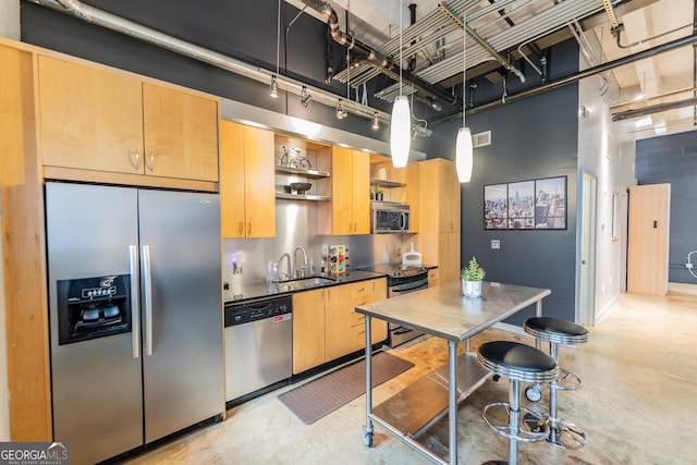 kitchen featuring stainless steel appliances, open shelves, a sink, and light brown cabinetry