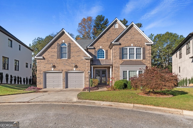 front of property featuring a front yard, french doors, and a garage