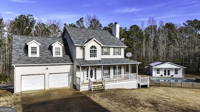 view of front facade with a porch and a garage