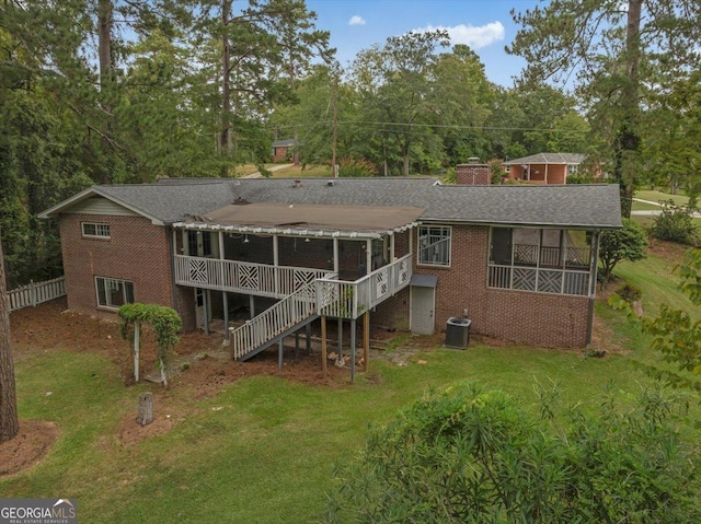 view of property exterior with a wooden deck and a lawn