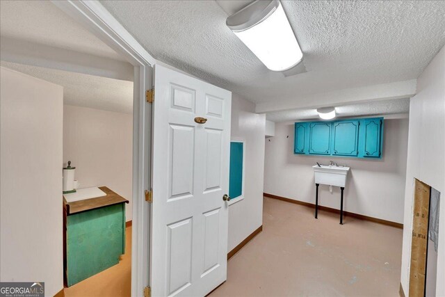 kitchen featuring tasteful backsplash, ventilation hood, white cabinetry, and stainless steel gas cooktop