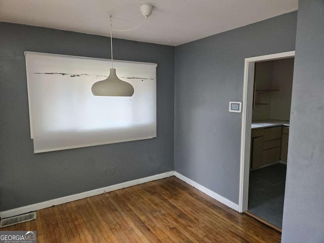 unfurnished dining area with hardwood / wood-style floors