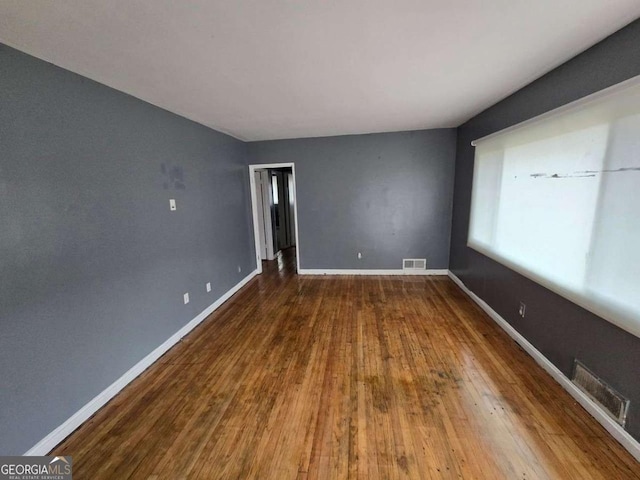 empty room featuring hardwood / wood-style floors