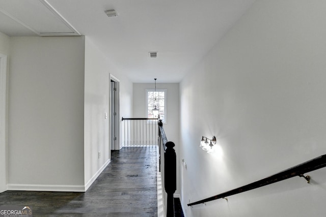 hallway featuring dark hardwood / wood-style flooring