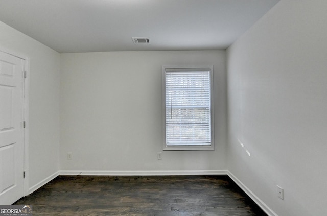 unfurnished room featuring dark hardwood / wood-style floors