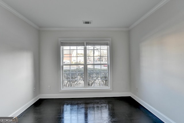 unfurnished room featuring ornamental molding