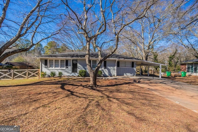 ranch-style house with a carport