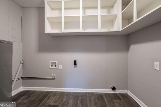 washroom with hookup for a washing machine, dark hardwood / wood-style floors, and electric dryer hookup