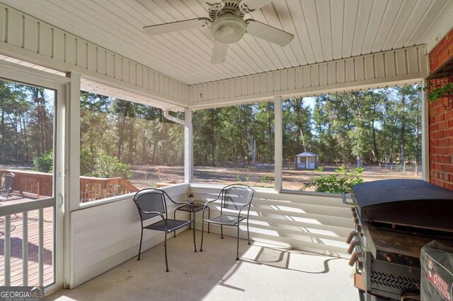 wooden deck featuring a sunroom