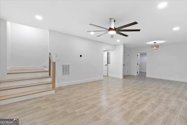 unfurnished living room featuring ceiling fan