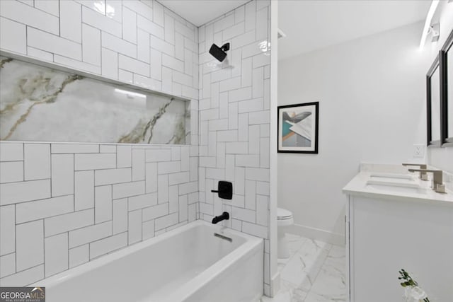 full bathroom featuring toilet, vanity, and tiled shower / bath