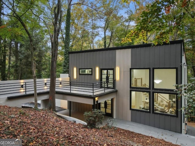 back of property with a balcony