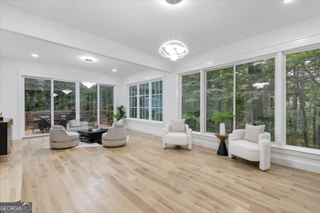 unfurnished sunroom featuring a notable chandelier