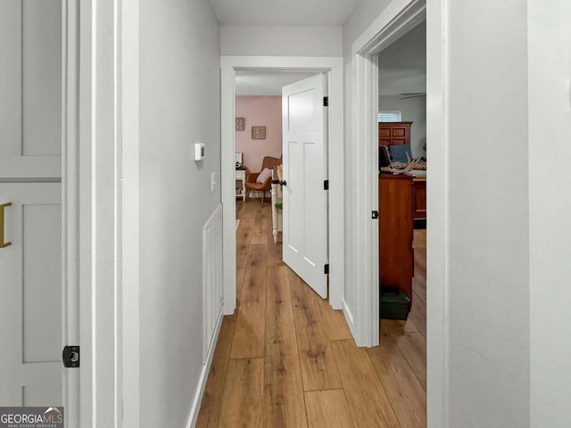 corridor featuring light wood-type flooring