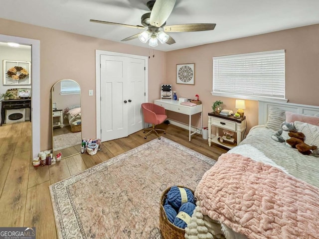 bedroom featuring ceiling fan and wood-type flooring