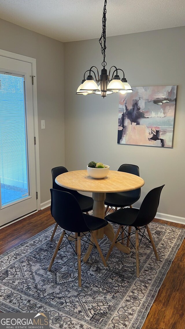 unfurnished living room with a textured ceiling, ceiling fan, and dark wood-type flooring