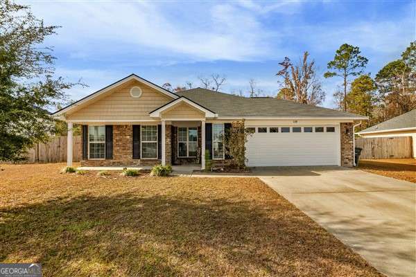 ranch-style home featuring a porch and a garage