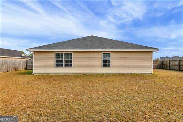 view of property exterior with a lawn