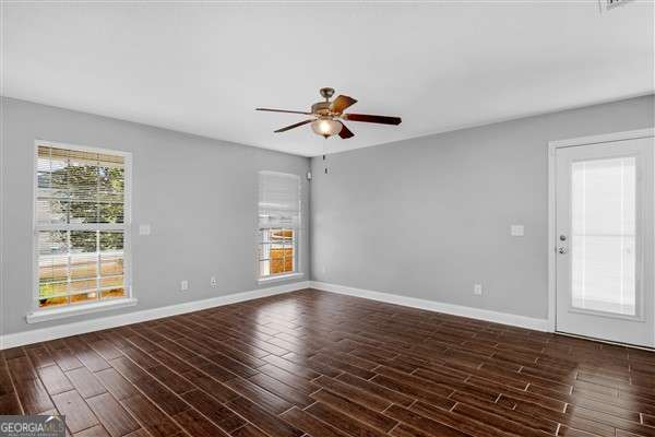 unfurnished room with ceiling fan