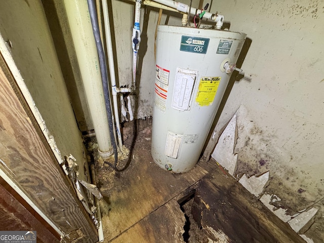 utility room featuring water heater