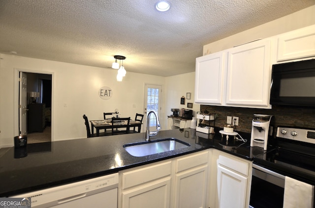 kitchen featuring tasteful backsplash, sink, dishwasher, white cabinetry, and stainless steel electric range