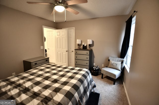 carpeted bedroom featuring ceiling fan