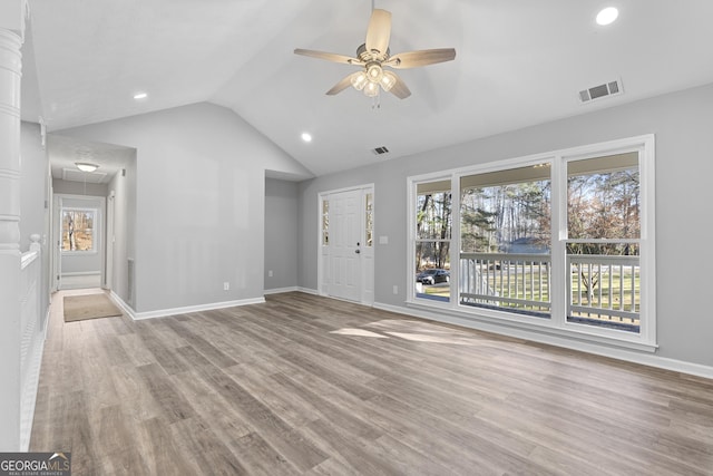 unfurnished living room featuring ceiling fan, light hardwood / wood-style floors, and lofted ceiling