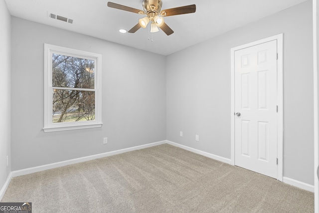 empty room featuring carpet and ceiling fan